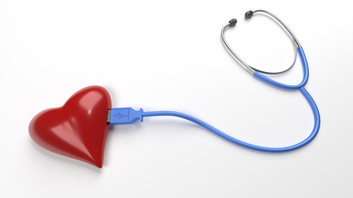 A picture of a heart with a USB stethoscope plugged into it.