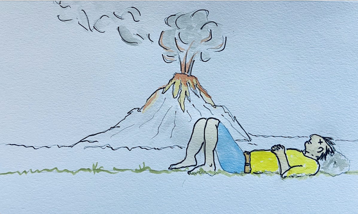 Man naps next to volcano