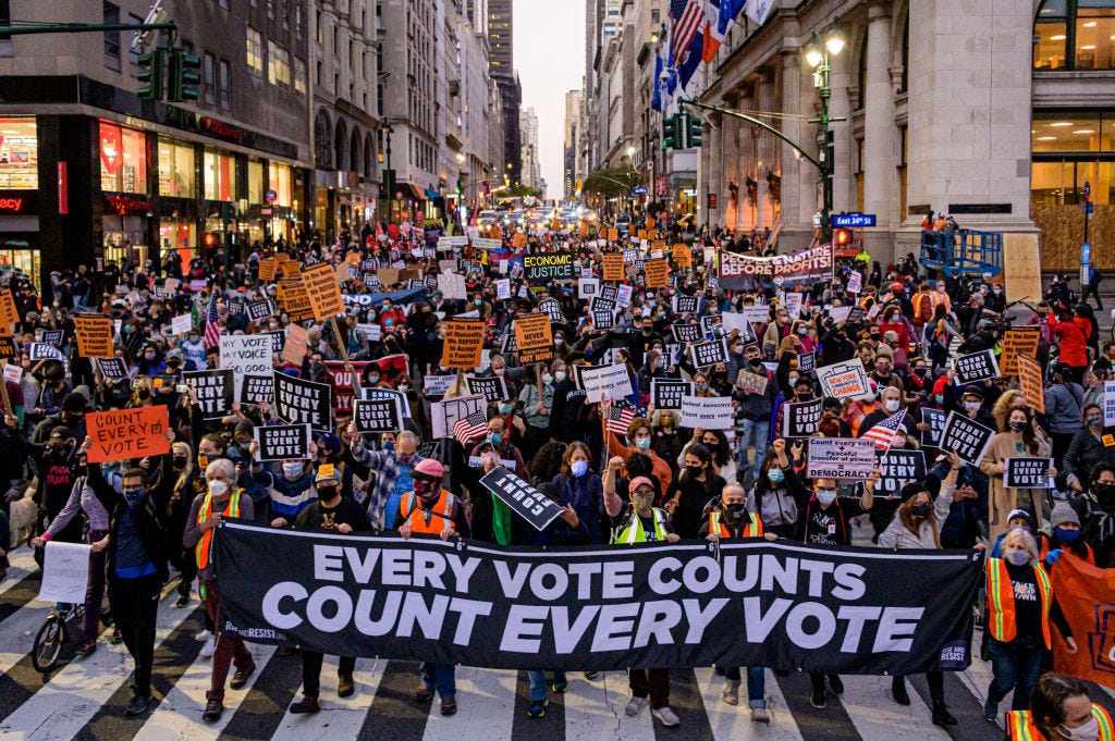 2020/11/04: Participants holding a banner reading: "EVERY VOTE COUNTS/COUNT EVERY VOTE" at the protest. 
