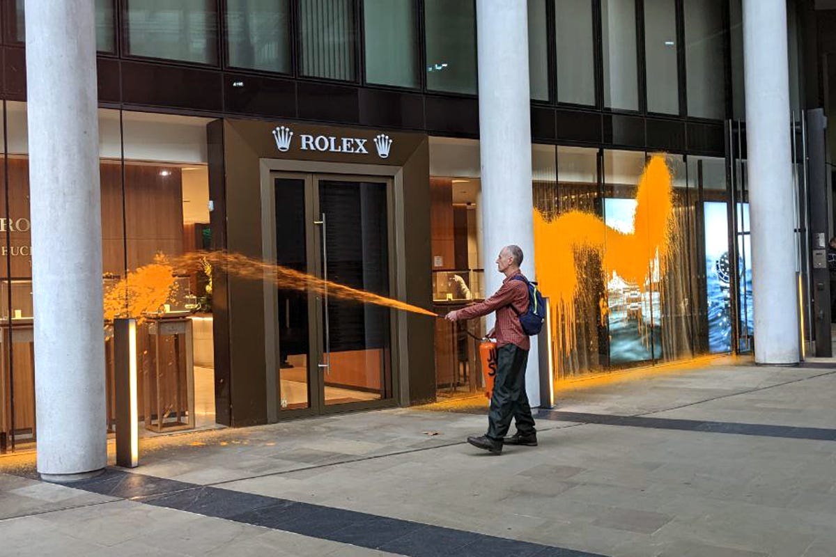 Just Stop Oil activists spray orange paint on Rolex building in central  London | Evening Standard