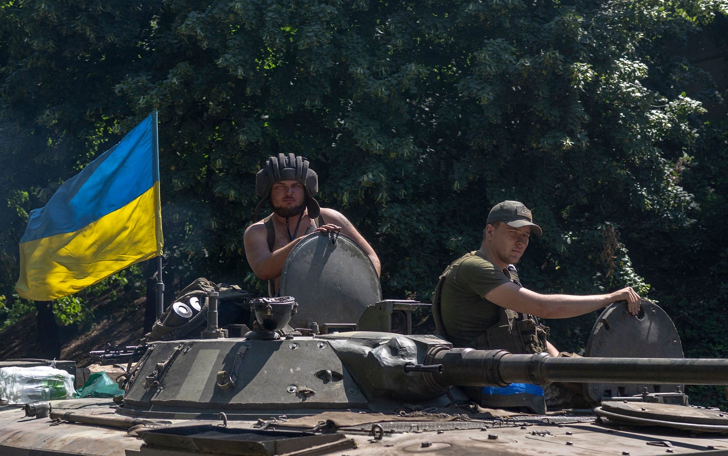 Ukrainian soldiers drive to the front line on July 31, 2022. (Photo by Bulent Kilic via Getty Images).