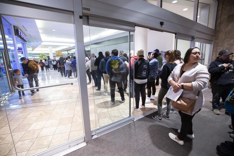 Griselda Calito, right, waits in line to vote at the Galleria at Sunset shopping mall in Henderson, Nev., Tuesday, Nov. 8, 2022. (Steve Marcus/Las Vegas Sun via AP)