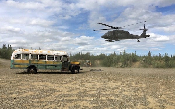 An Alaskan army helicopter removes the Into The Wild bus from the wilderness