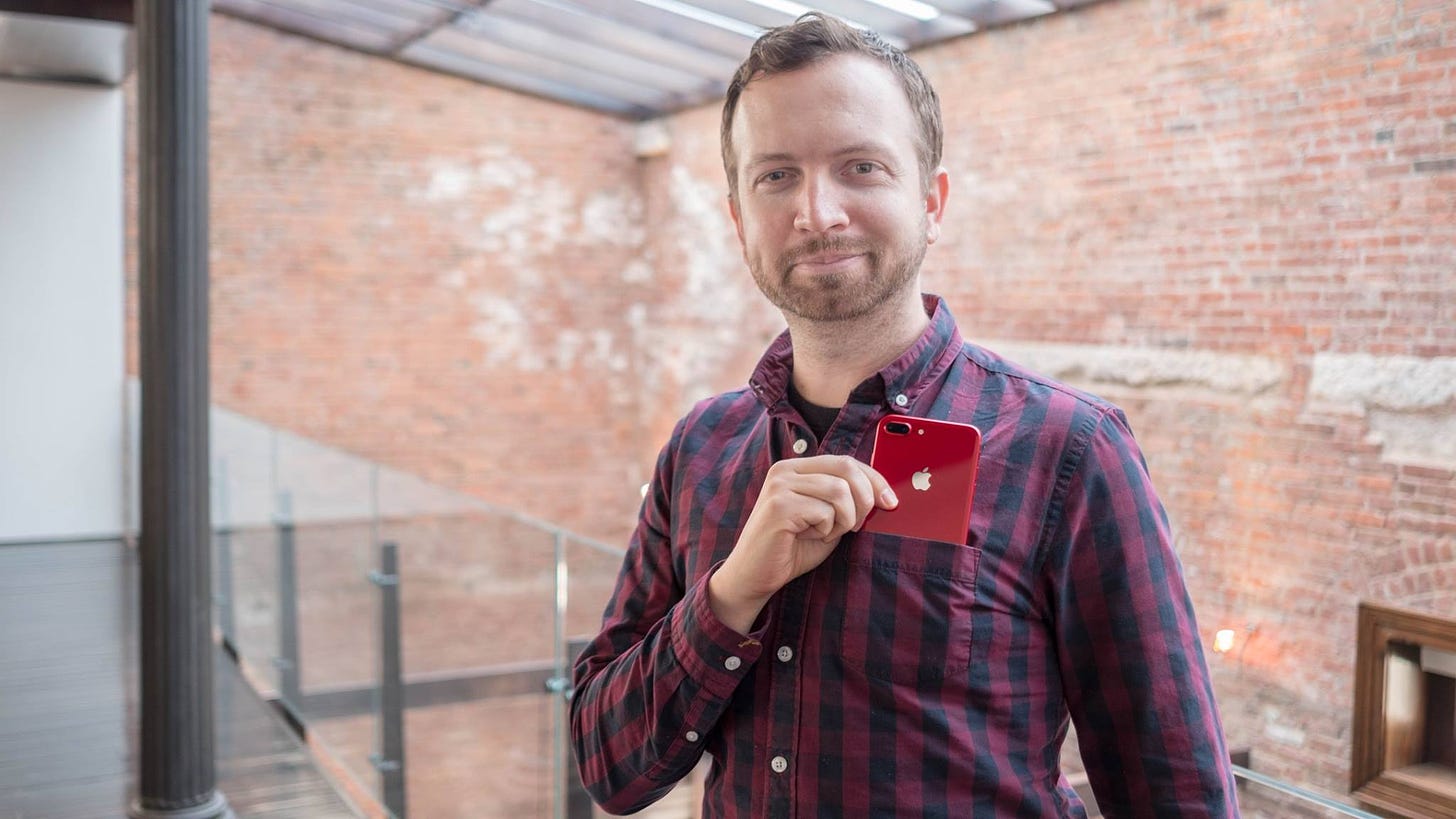 Tech journalist and expert Matt Swider reviewing an iPhone at an Apple event