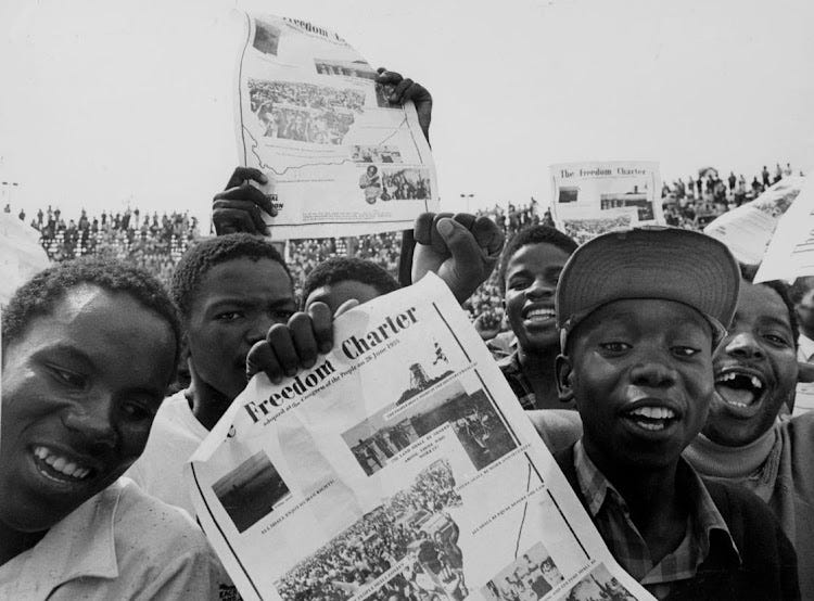 Youths brandish the Freedom Charter in Soweto in 1986.