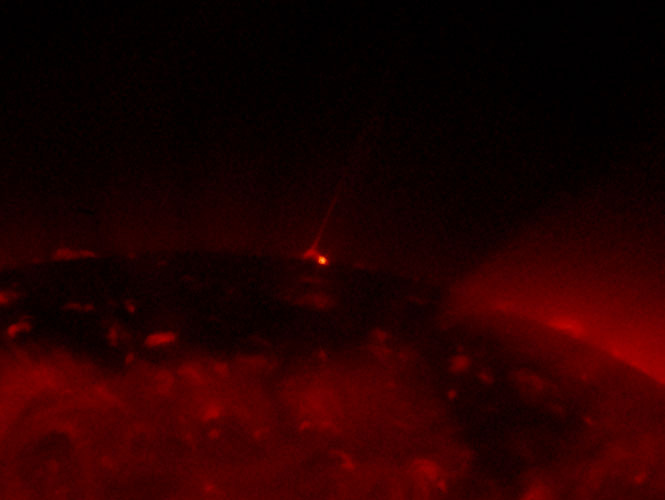 An image of the Sun taken through a telescope. The picture looks like Gustav Holst "Mars" feel.