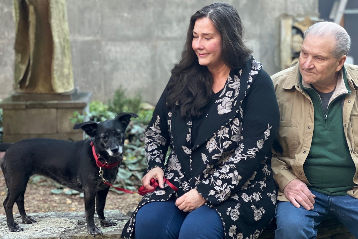 image of a family portrait of Tracy, the author, and their beloved dog, Ruby. -Love, Dog-