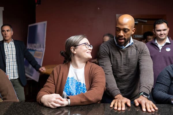 Allyse Barba speaking with Mandela Barnes, the Democratic candidate for the Senate from Wisconsin, at an event in La Crosse. Ms. Barba does not believe voting will make a difference in Wisconsin.