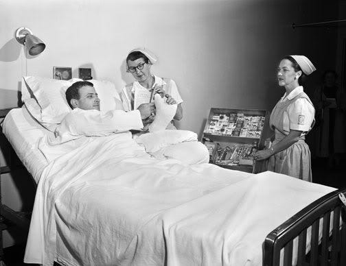 A hospital patient buying cigarettes by his bed (1950s) (Dengan ...