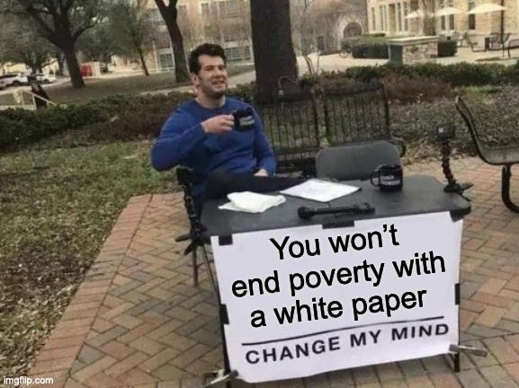 "Change my mind meme" with the caption "you won't end poverty with a white paper change my mind"