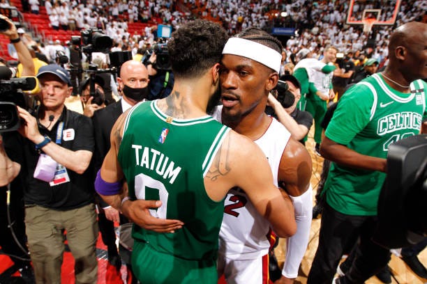 Jayson Tatum of the Boston Celtics embraces Jimmy Butler of the Miami Heat after Game 7 of the 2022 NBA Playoffs Eastern Conference Finals on May 29,...