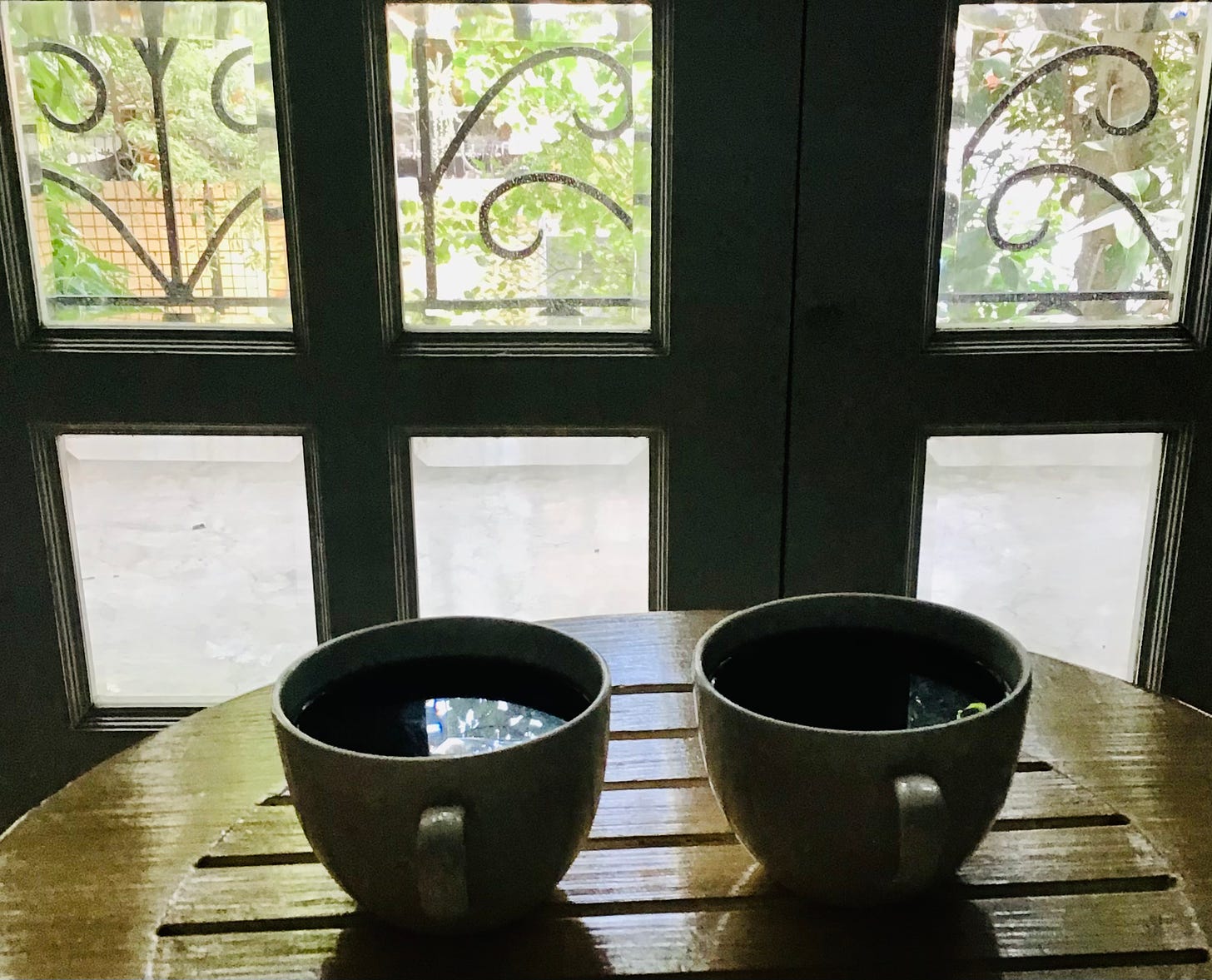 Two cups of freshly brewed coffee