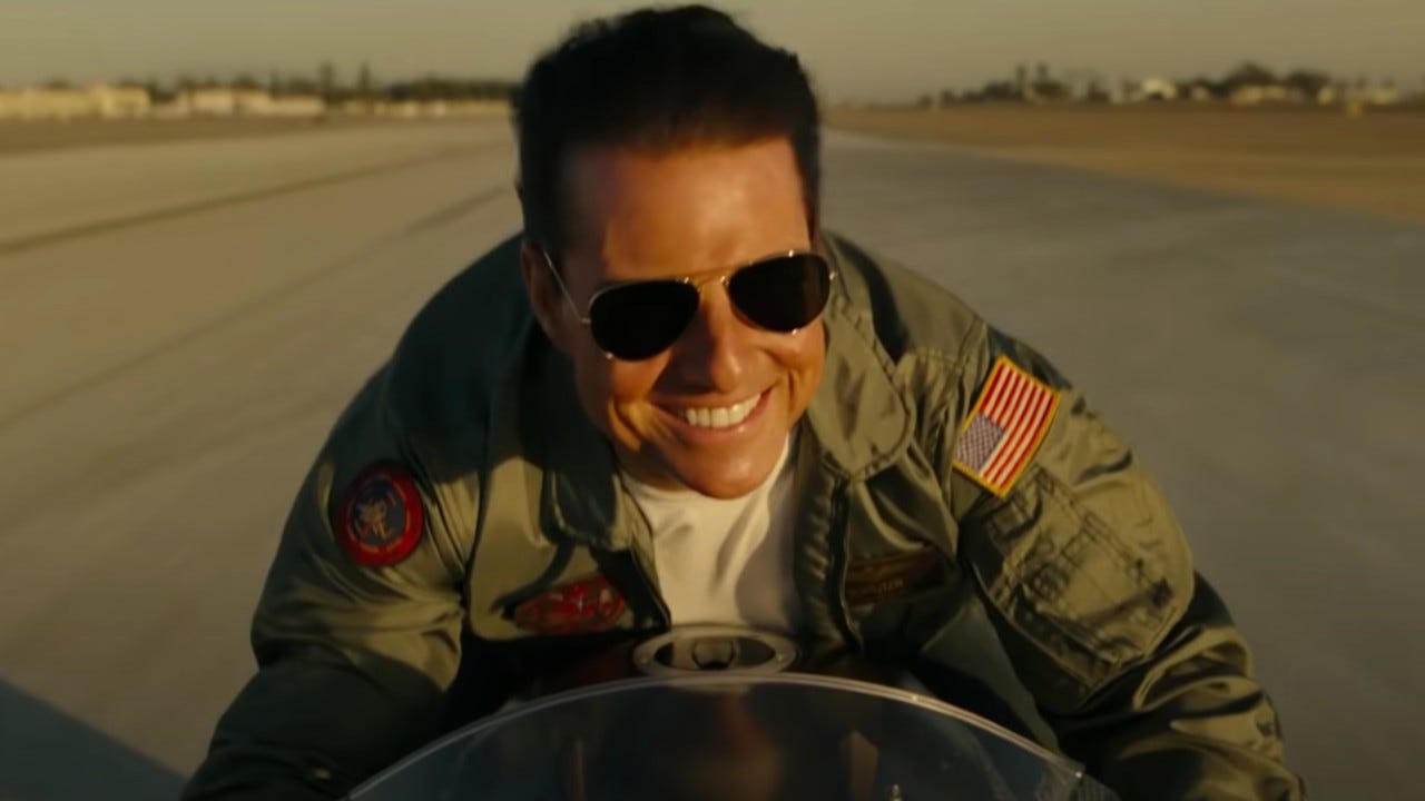 Tom Cruise’s smile is as electric as ever in Top Gun: Maverick.