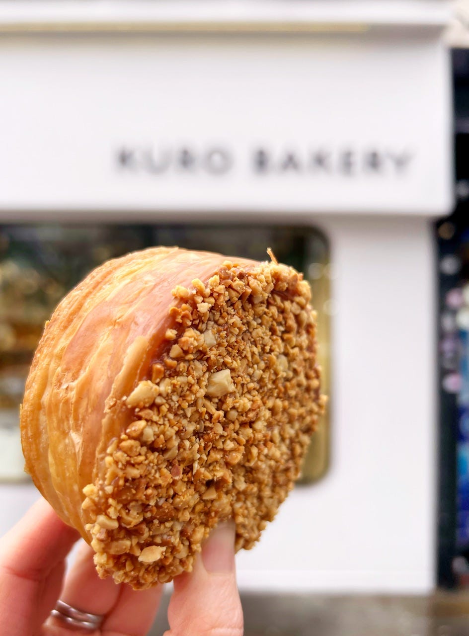 Sakuro croissant with peanuts in front of the Kuro Bakery