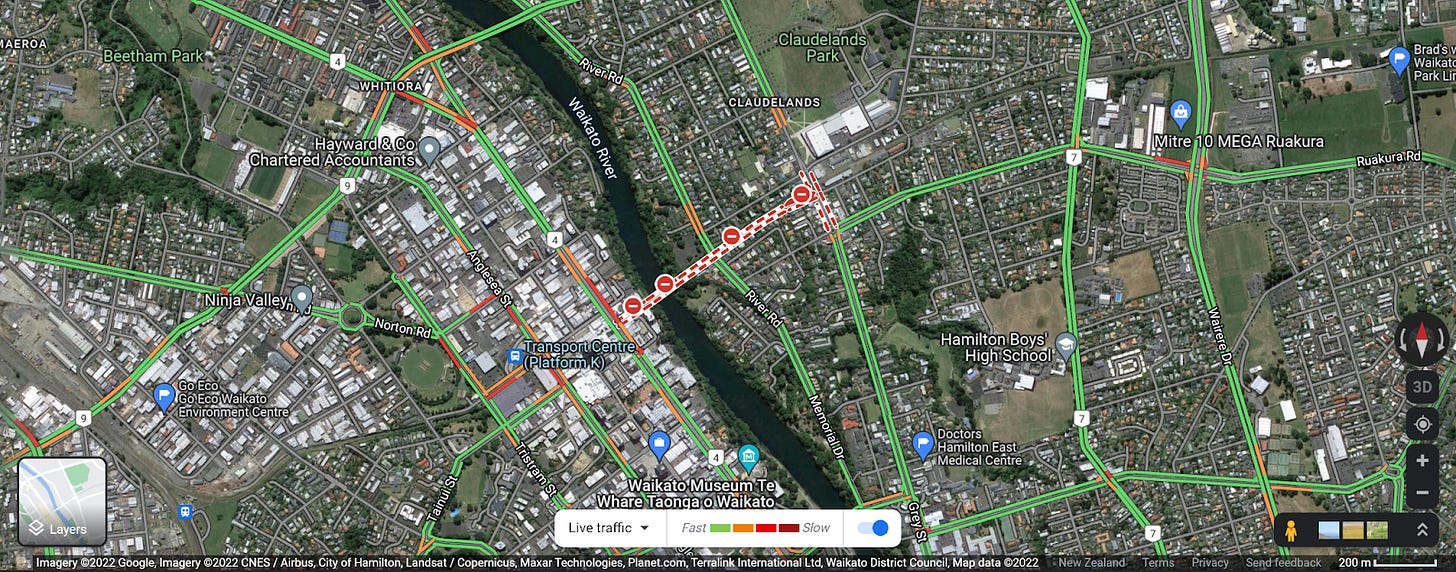 A Google Maps screenshot showing Waikato River between Boundary Road Bridge and Anzac Bridge. Claudelands Bridge is in the centre of the map, red and white symbols indicate the bridge is closed.