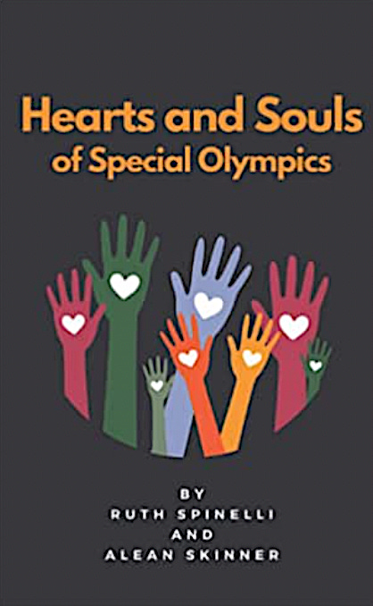 The cover of the book “Hearts and Souls of Special Olympics.” The title is light orange on a black background. Beneath it are a number of upraised colorful hands with white hearts on their palms. The authors’ names “by Ruth Spinelli and Alean Skinner” are in white block letters at the bottom.