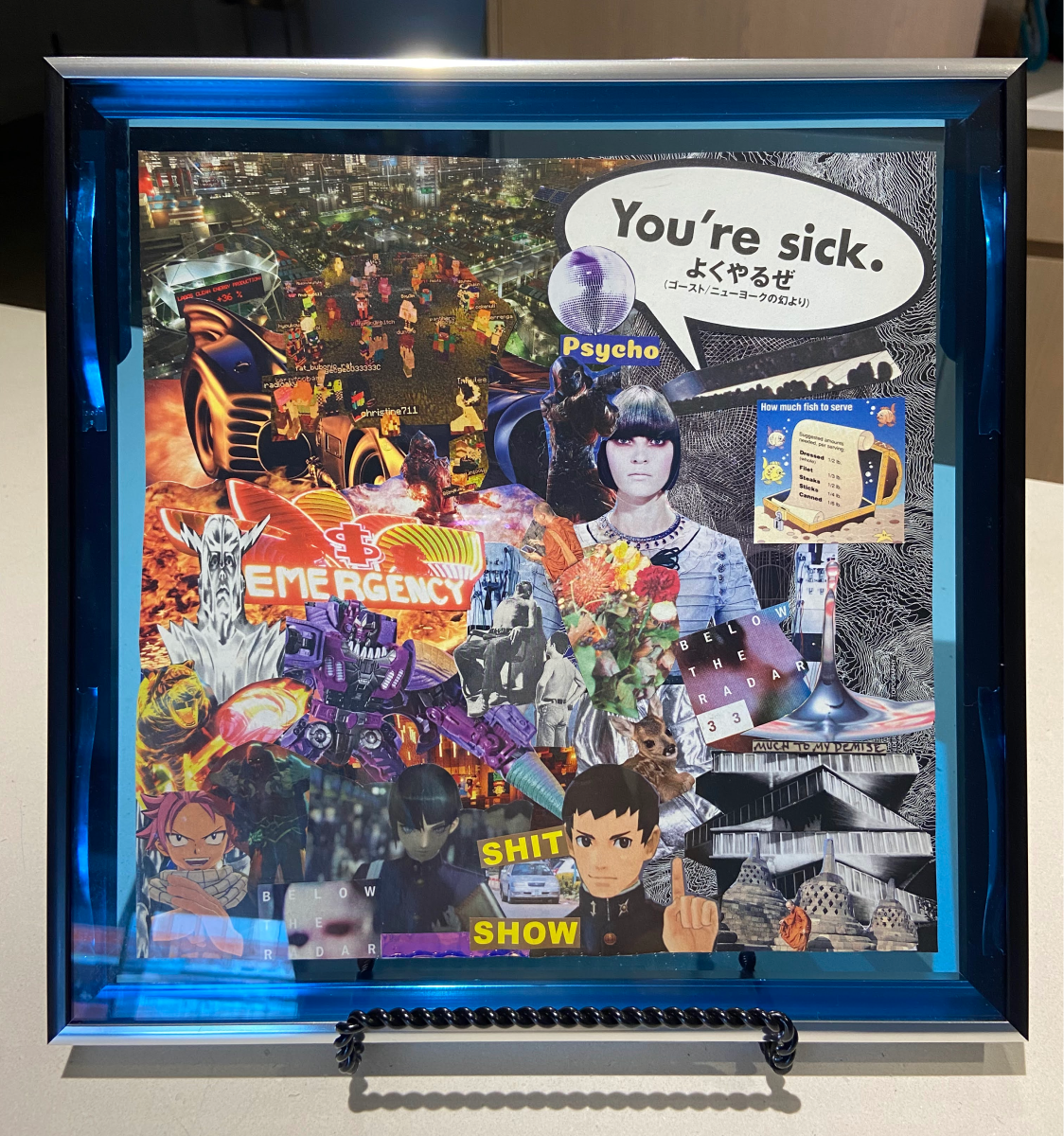 A blue framed collage from LotyDoty's first collection.