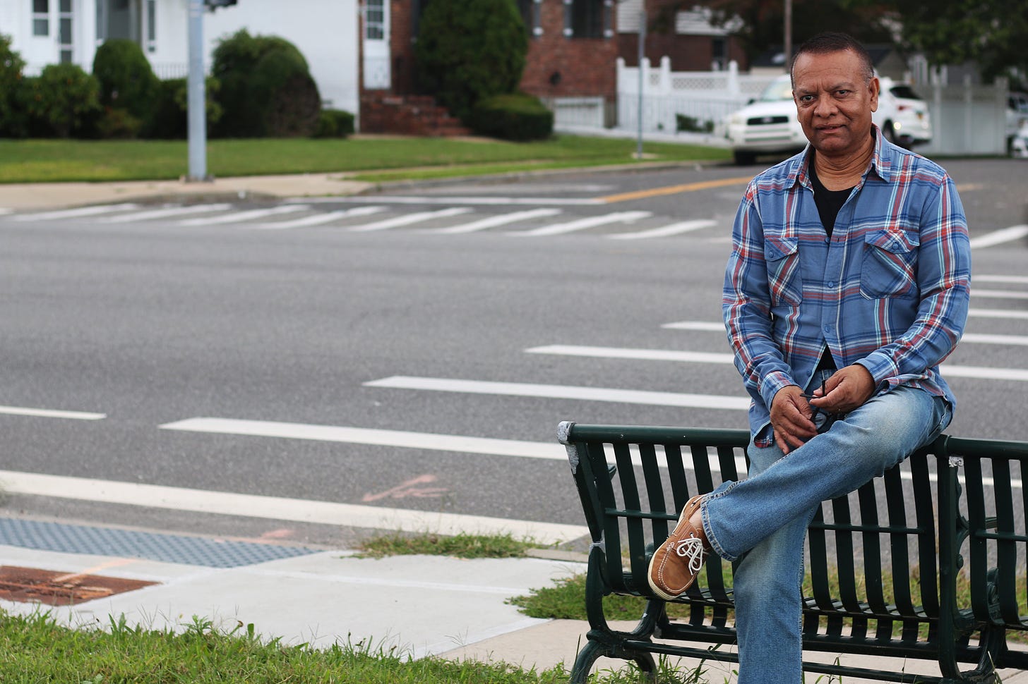 Stanley Praimnath sits in Elmont, N.Y, the Long Island town where he lived in 2001. Photo by Micah Danney.