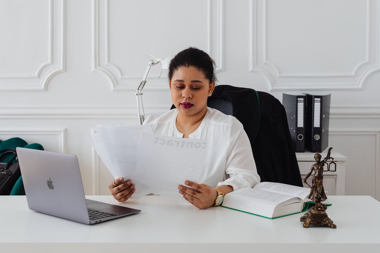 lawyer woman reading contract