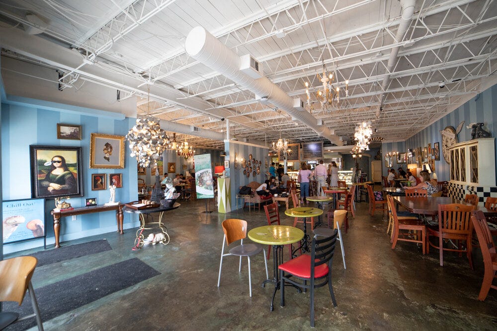 A wide angle view of the interior of Amélie’s Bakery in Atlanta.
