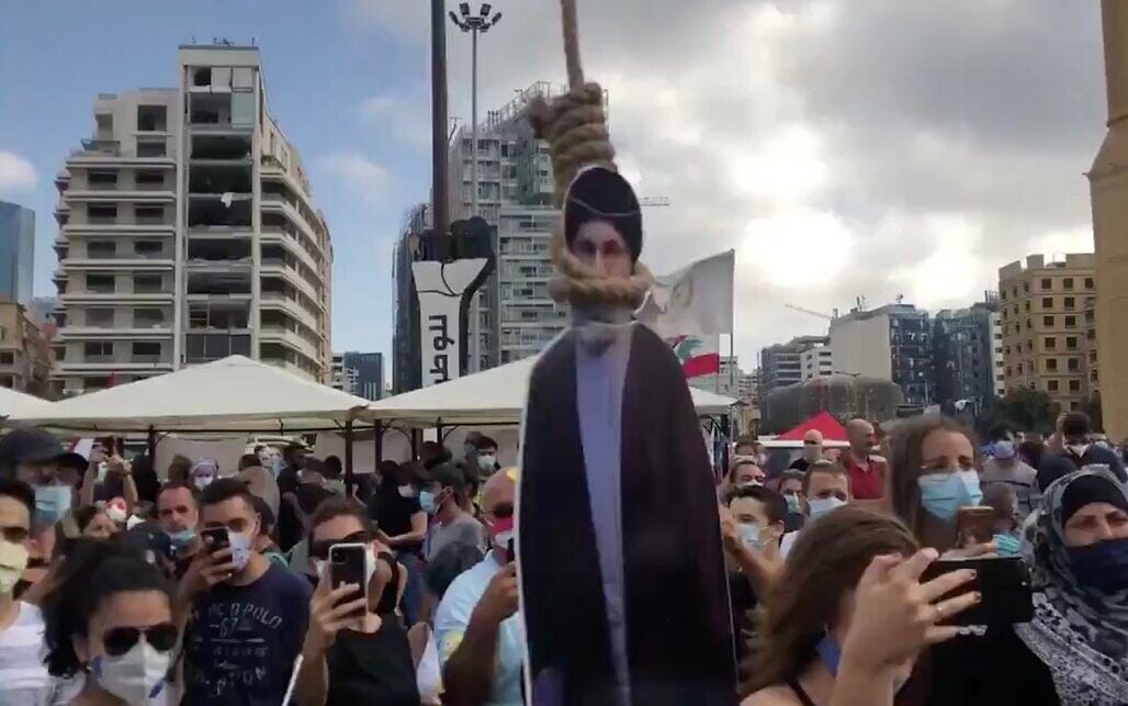 Cutout of Hezbollah's Nasrallah hung in noose during protest over ...