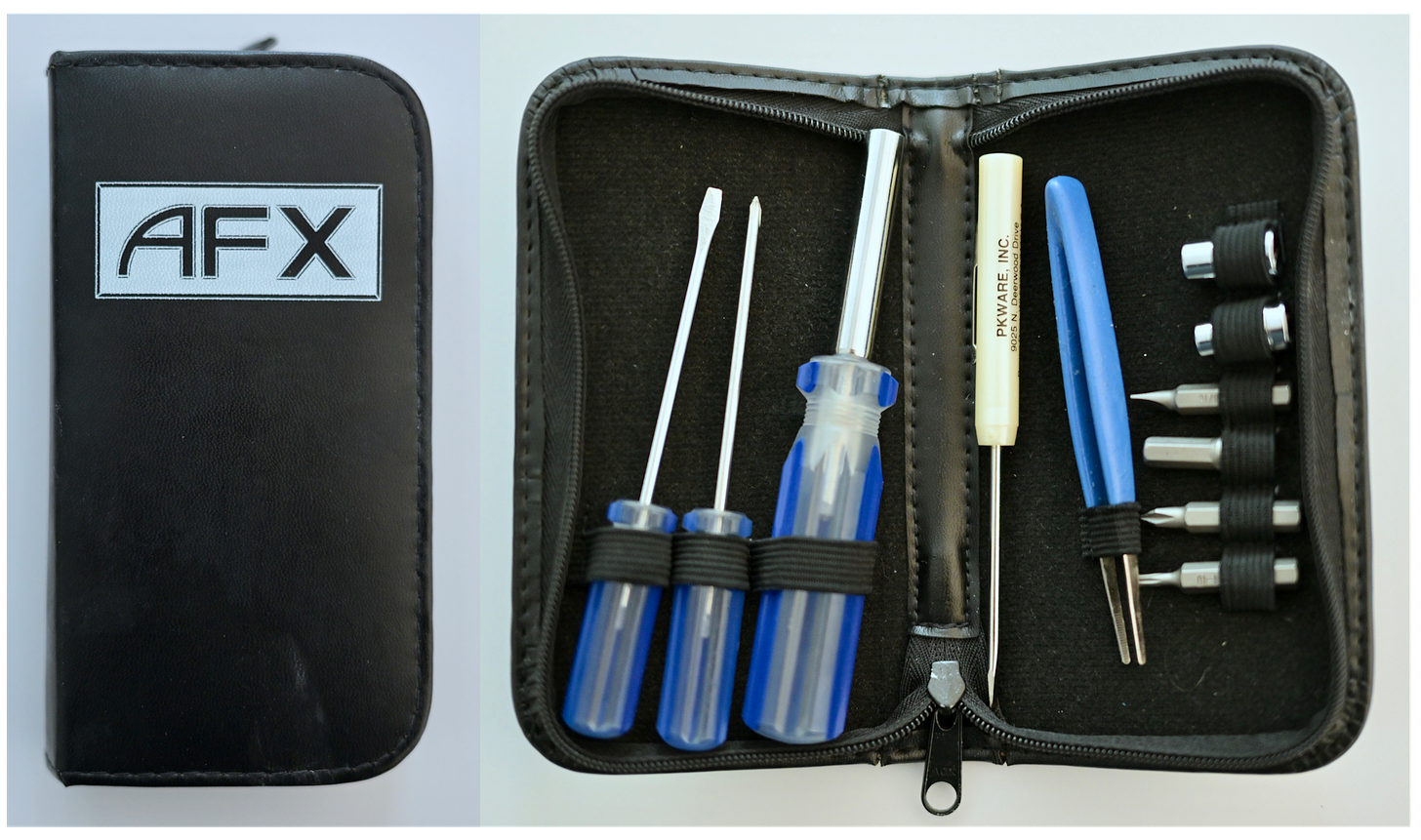 A small portable set of computer tools in a faux leather case.  There's a couple of screwdrivers and tweezers.