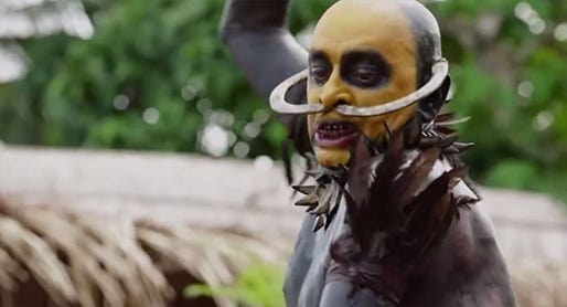 The Bald Headhunter (Ramon Liao) takes a swing for his latest trophy in Eli Roth's "The Green Inferno," a Universal Pictures release.