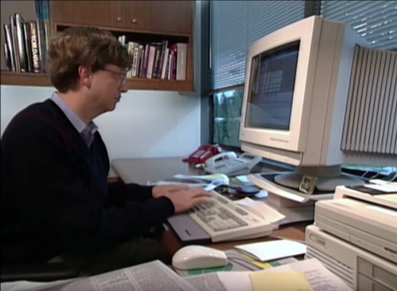Photo of Bill Gates working at a computer, c. 1994
