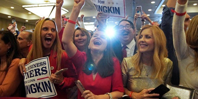 Supporters of Republican nominee for Governor of Virginia Glenn Youngkin react as Fox News declares Youngkin has won his race against Democratic Governor Terry McAuliffe and Youngkin will be the next Governor of Virginia during an election night party at a hotel in Chantilly, Virginia, U.S., November 3, 2021. REUTERS/ Elizabeth Frantz?