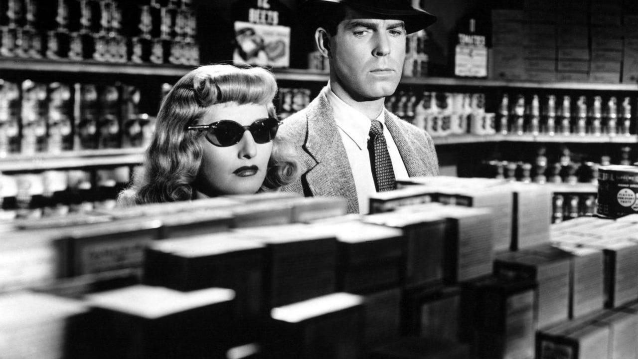 Barbara Stanwyck and Fred MacMurray in Double Indemnity (1944) dir. by Billy Wilder. It is the scene where they are discussing the insurance fraud scheme in the grocery store.