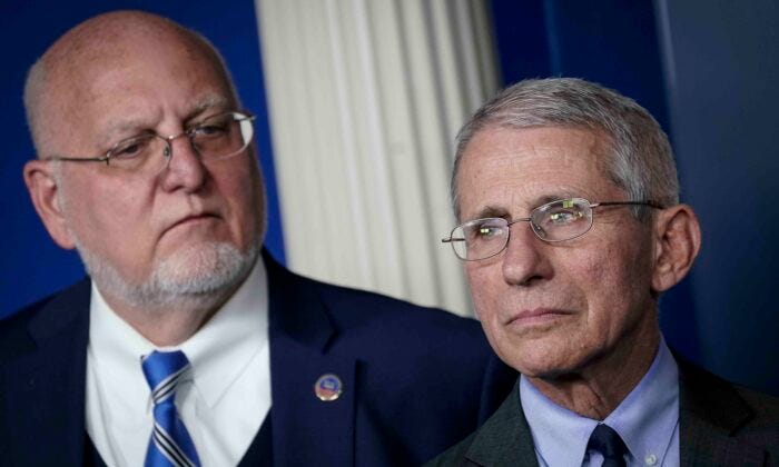 (L-R) Robert Redfield, director of the Centers for Disease Control and Prevention, and Dr. Anthony Fauci, director of the National Institute of Allergy and Infectious Diseases, attend a briefing on the administration's CCP virus response in the press briefing room of the White House in Washington on March 2, 2020. (Drew Angerer/Getty Images)