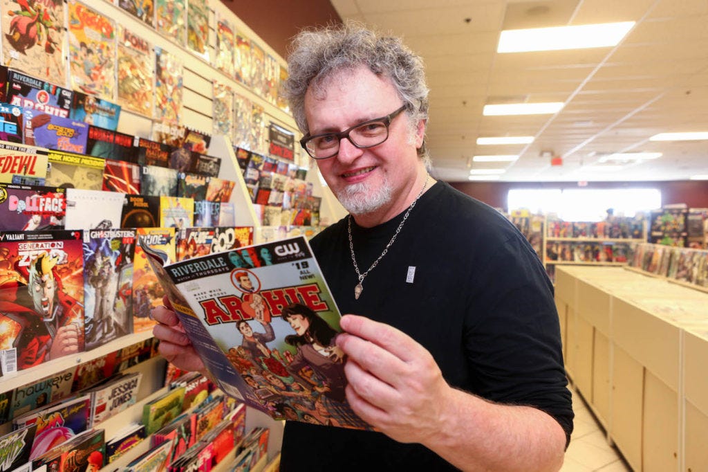 Tom Peyer with a comic by Mark Waid