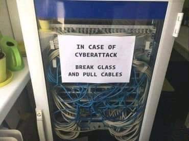 May be an image of text that says 'IN CASE OF CYBERATTACK BREAK GLASS AND PULL CABLES'
