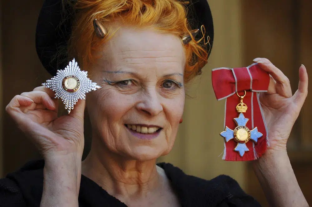 FILE - Dame Vivienne Westwood poses for a photo after collecting her insignia from Britain's Prince Charles during an Investiture ceremony at Buckingham Palace, London on June. 9, 2006. Westwood, an influential fashion maverick who played a key role in the punk movement, died Thursday, Dec. 29, 2022, at 81. (Fiona Hanson, Pool via AP, File)