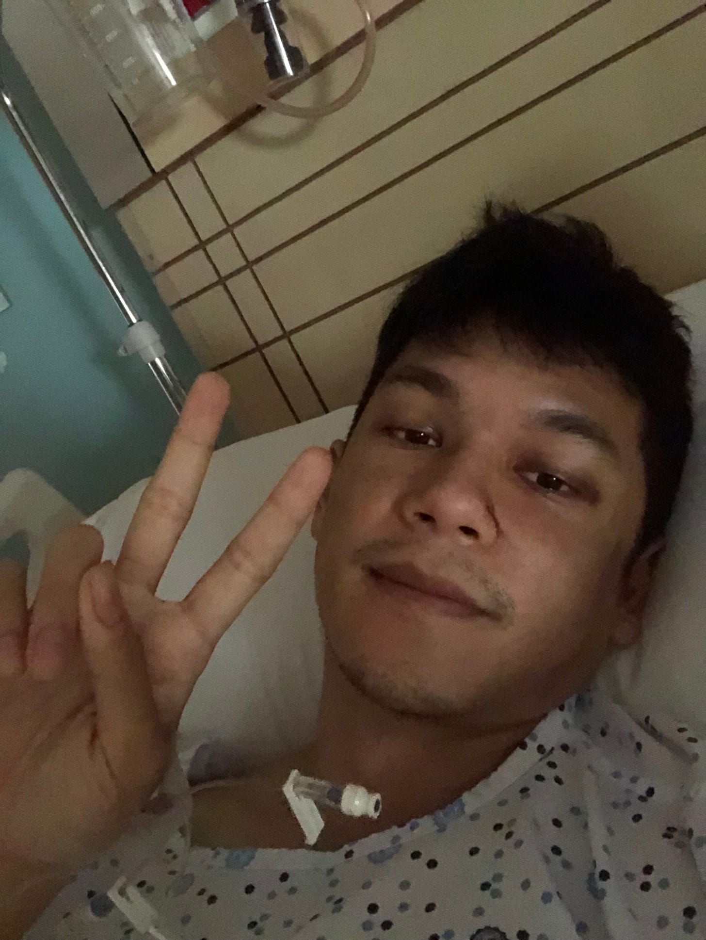 Selfie by author in hospital bed.