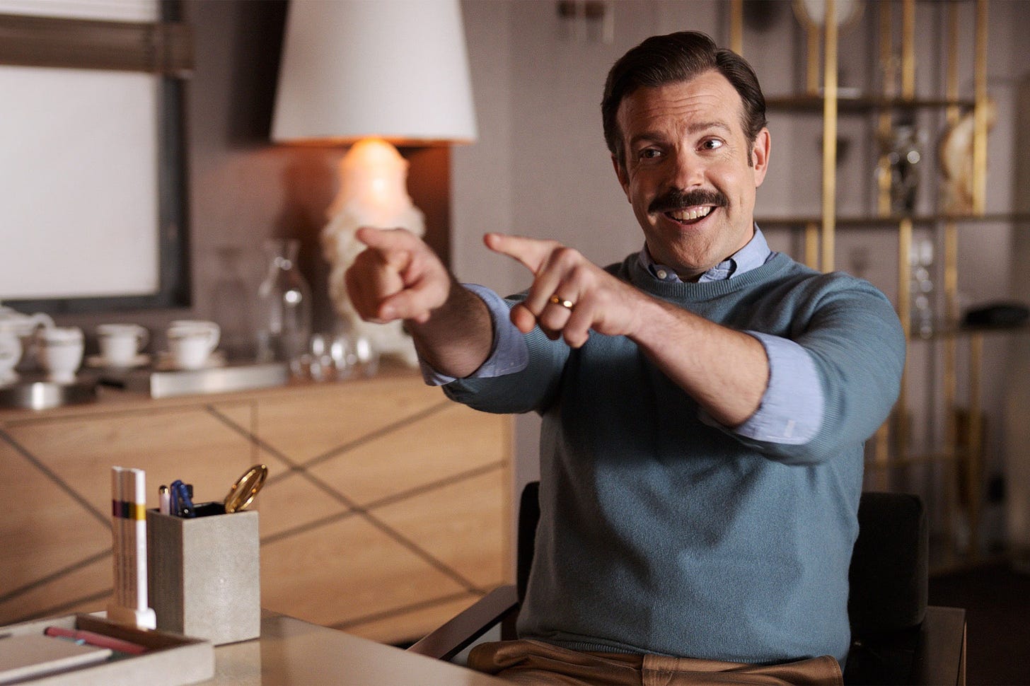 Ted Lasso pointing with both hands