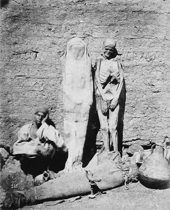 An Egyptian mummy dealer selling his wares in 1870. How much potential knowledge have we lost due to the popularity of mummy brown pigment? (Public domain)