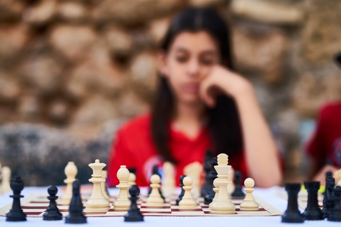 Free Woman Playing Chess Stock Photo