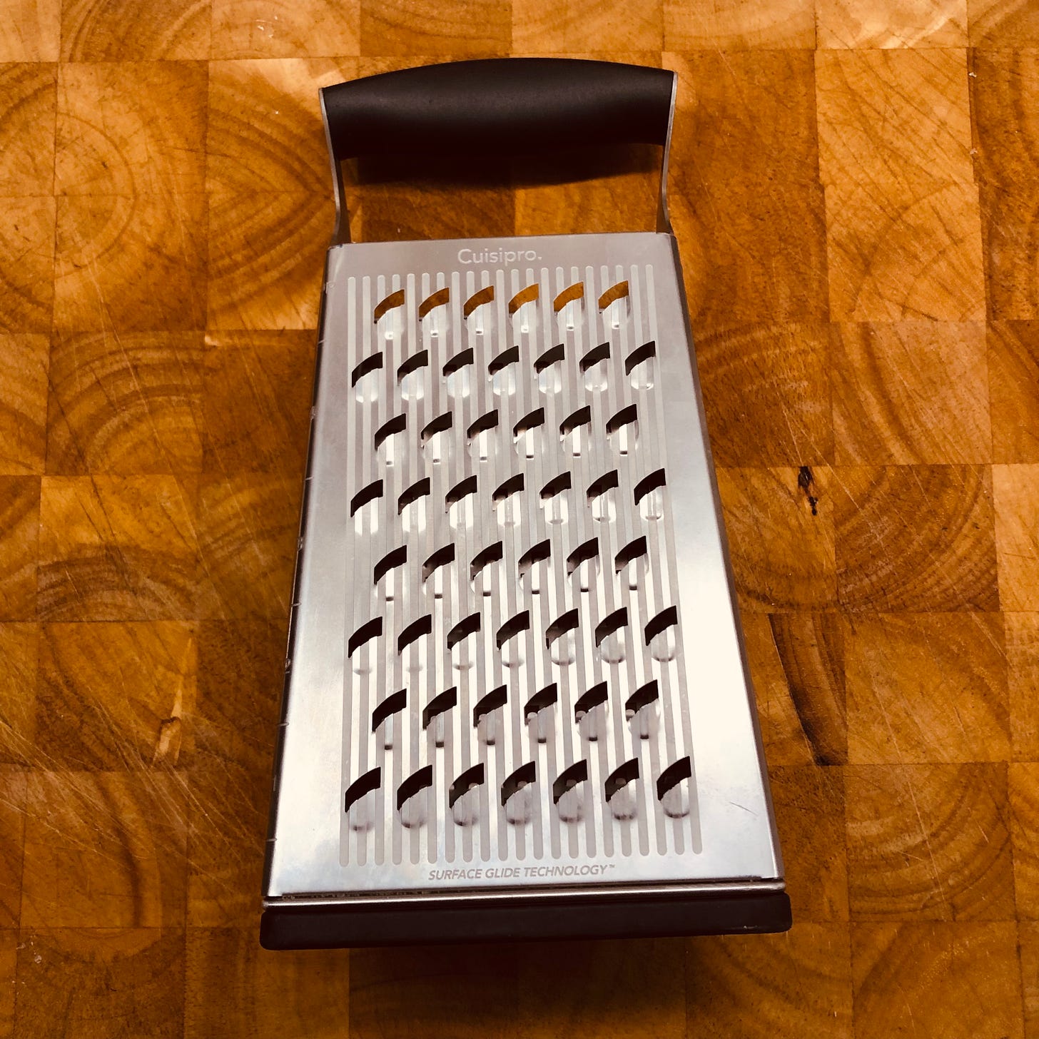 One side of the Cuisipro 4-Side Box Grater, showing the largest grating holes