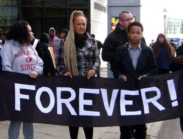 Rachel Dolezal with blond hair at a Black Lives Matter protest