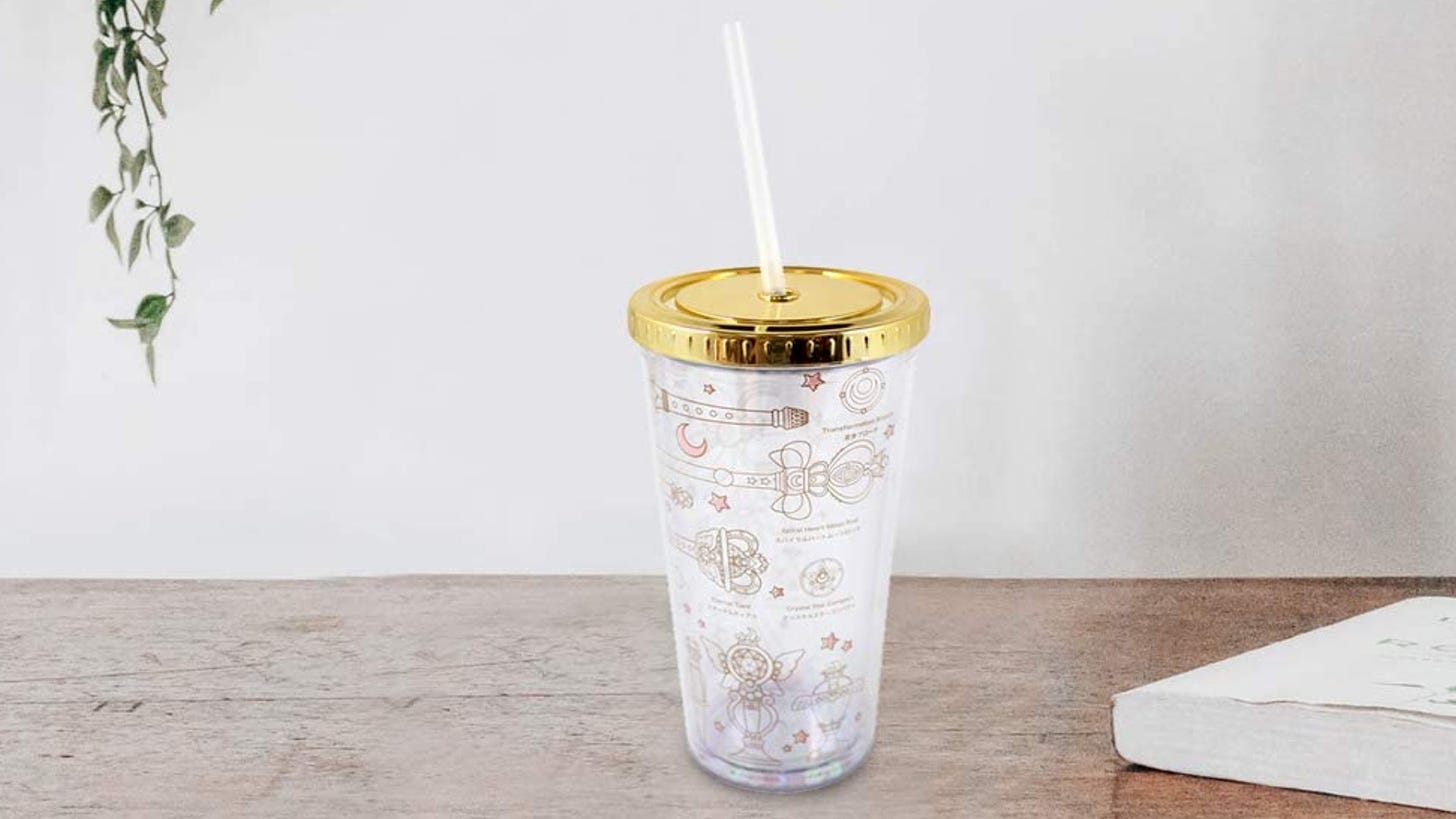 Gold and white Sailor Moon item tumbler with straw.