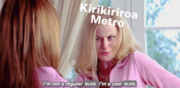 A screenshot from the film Mean Girls (2004), of Amy Poehler's character saying "I'm not a cool mom, I'm a regular mom" with the word "mom" covered over by "blog" and the text added over Amy Poehler's head which acts as a label, saying "Kirikiriroa Metro"