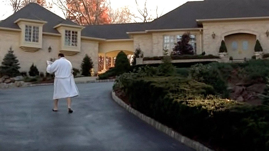 Tony Soprano gets the morning paper from his driveway in The Sopranos