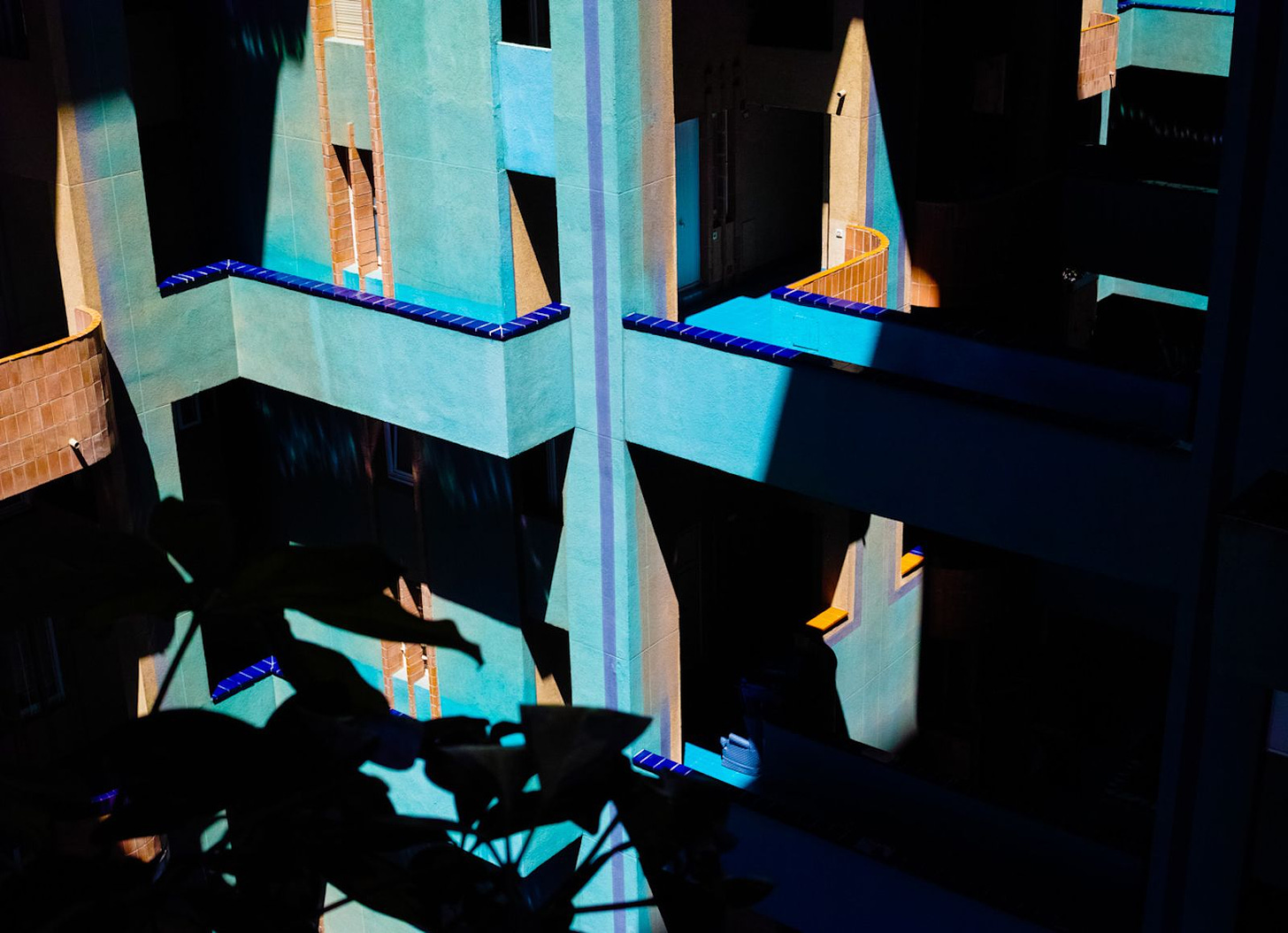 Multi-floor housing complex with shades of blue and shadows