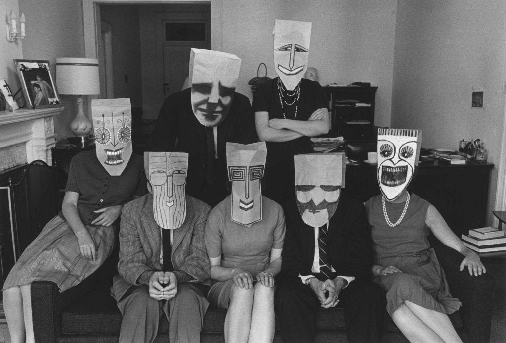 <em>Group Portrait with Masks</em> (from the Mask Series with Saul Steinberg), 1962. Photograph by Inge Morath, © The Inge Morath Foundation