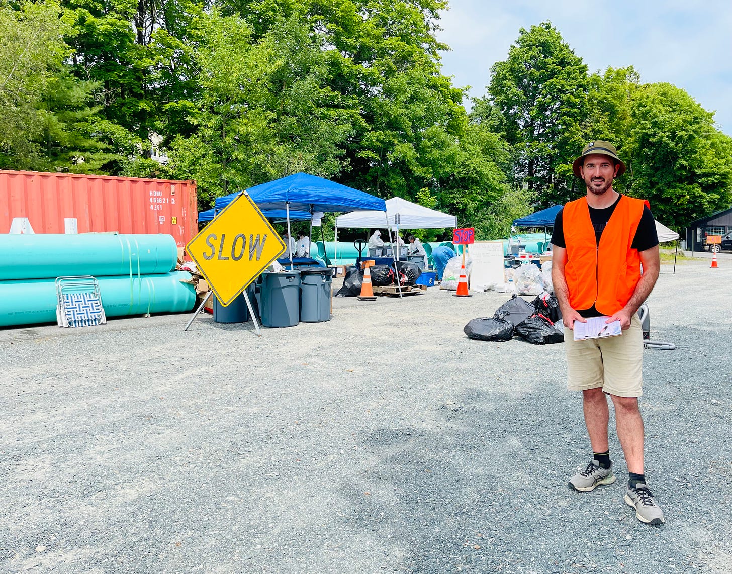 Jared Entwisle stands before the site of the Bar Harbor Waste Audit, Monday, July 18.