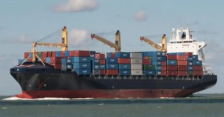 A geared container ship with onboard cranes. A geared container ship with onboard cranes.