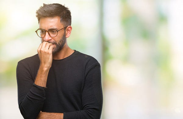 Man biting his nails (image courtesy of Harvard Healthbeat)