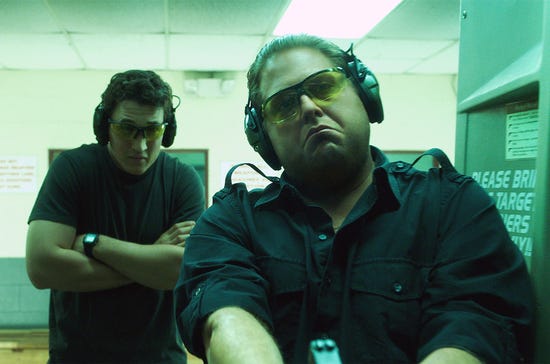 Gunrunners David Packouz (Miles Teller) and Efraim Diveroli (Jonah Hill) test the goods in "War Dogs," a 2016 comedy-drama from Warner Brothers.