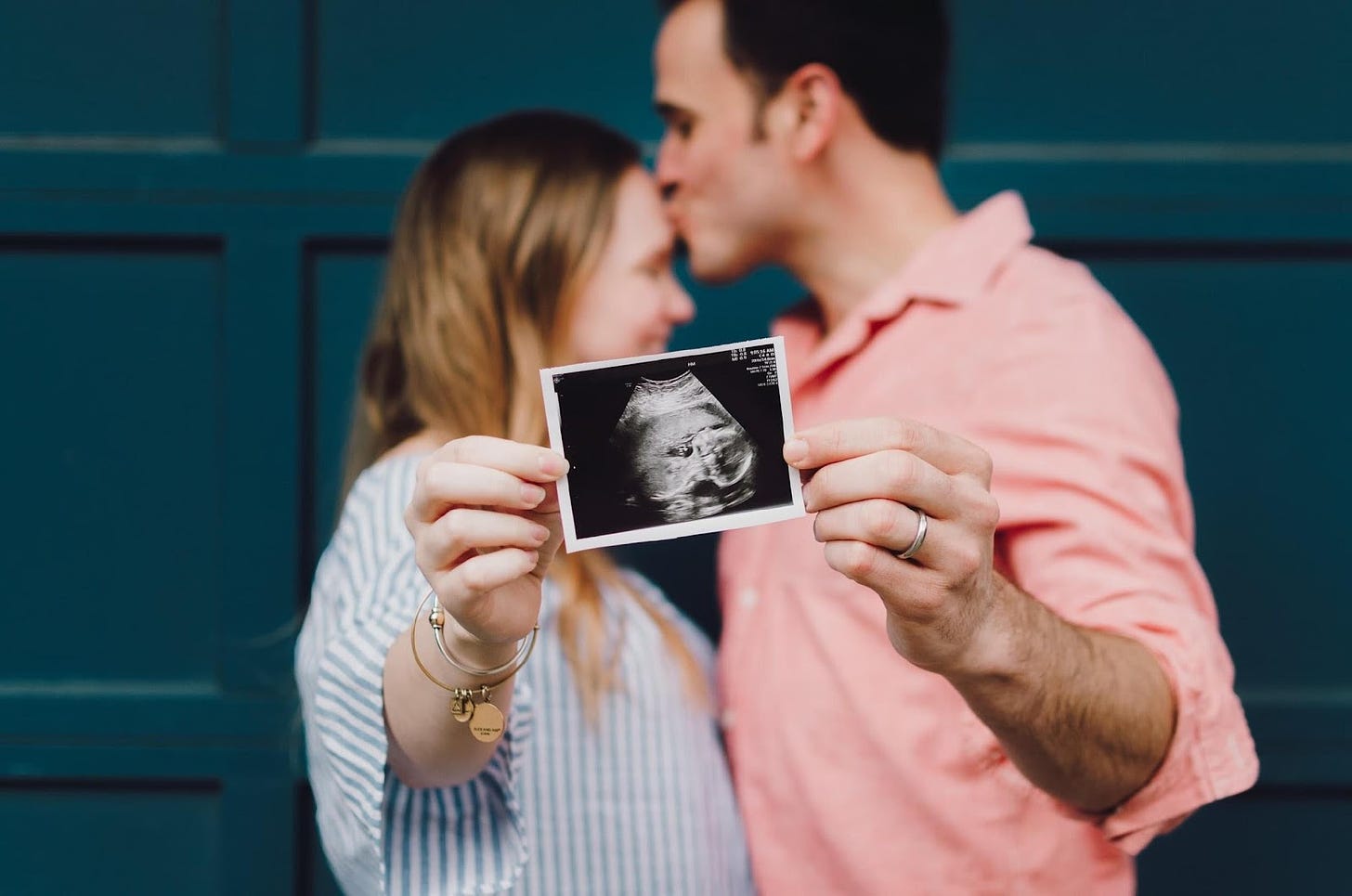 A person and person kissing

Description automatically generated with low confidence